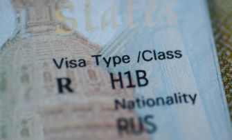 Close-up of a visa page displaying H-1B visa type and Russian nationality
