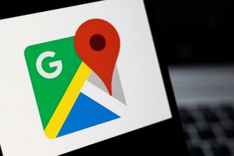 Close-up of Google Maps icon with a red location pin on a map.