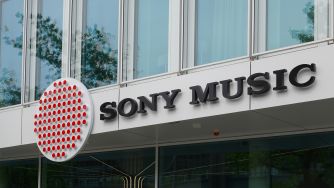 Exterior view of a Sony Music office building with the Sony Music sign and red circular logo.