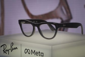 Black Ray-Ban smart glasses on display with Ray-Ban and Meta logos.