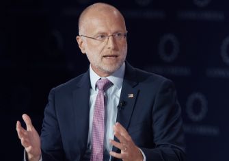 Brendan Carr, FCC Chairman, speaks and gestures during a panel discussion.