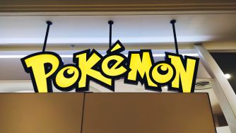 Pokémon logo signage displayed indoors.