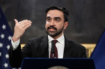 Zohran Mamdani, New York City mayor, speaks at a podium during a press conference.