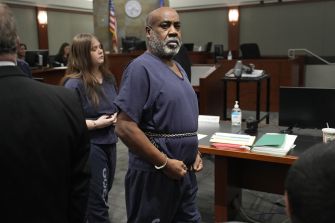James "Mob James" McDonald, a former Mob Piru Bloods member and witness in the Tupac Shakur murder trial, stands in a Clark County, Nevada courtroom.