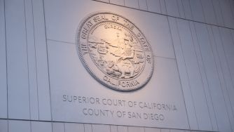 Close-up of the Seal of the Superior Court of California, County of San Diego, mounted on a wall.