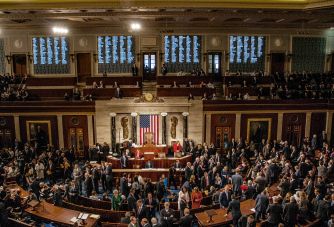 Members of Congress gather in the U.S. House chamber during a vote on ending U.S. military involvement in the Iran war.
