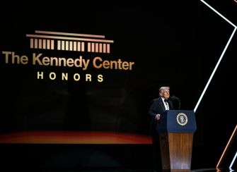 Donald Trump speaks at a podium onstage beneath a Kennedy Center Honors logo.