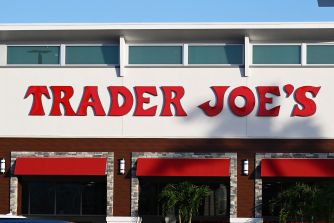Trader Joe’s storefront with the company’s red logo above the entrance.
