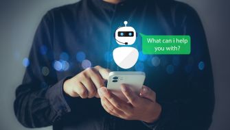 Person using a smartphone while a chatbot graphic asks, “What can I help you with?”
