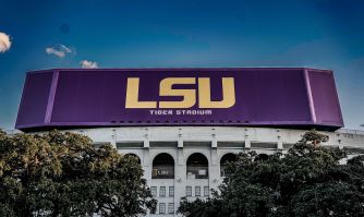 LSU’s Tiger Stadium facade, with the university’s purple-and-gold logo above the entrance.