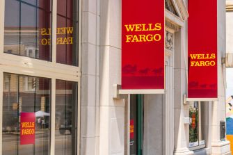 Wells Fargo branch storefront with red Wells Fargo signs.