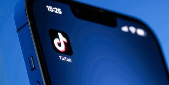 TikTok app logo displayed on a smartphone screen.