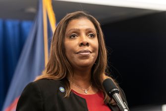 New York Attorney General Letitia James speaks at a podium during a press event.