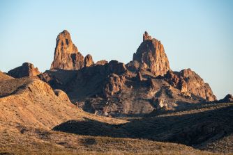 Rocky desert mountains in Big Bend National Park, Texas, under a clear blue sky.