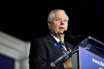 Lindsey Graham speaks at a lectern during a public event.