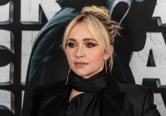 Hayden Panettiere poses in a black outfit at a red-carpet event.