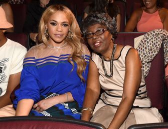 Faith Evans and Voletta Wallace sit together at an event.