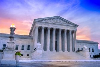 The U.S. Supreme Court building at sunset, symbolizing a key ruling on federal agency power.