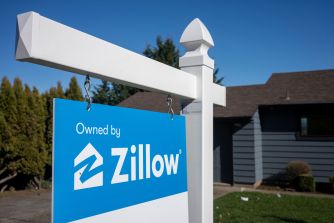 Sign with Zillow branding displayed outside a residential property.