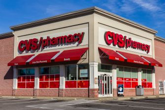 Exterior view of a CVS pharmacy building with red signage and awnings.
