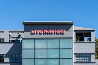 Facade of a Live Nation building with a red Live Nation sign against a blue sky.