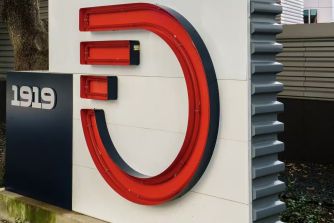 Signage of Frontier Communications displaying the company logo and address.