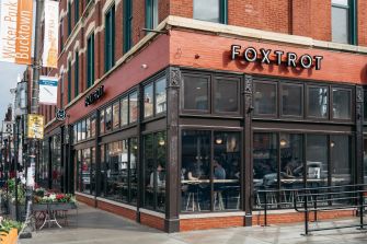 Exterior view of a Foxtrot store, a trendy grocery and restaurant-style establishment.