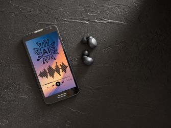 Smartphone on a dark surface showing an AI graphic and waveform, with wireless earbuds beside it.