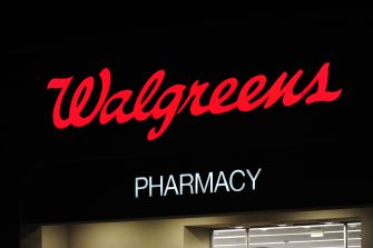 Walgreens pharmacy sign at night.