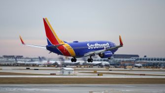 A Southwest Airlines plane taking off from an airport.