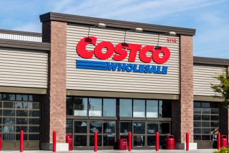 Facade of a Costco Wholesale store with large red COSTCO sign and blue WHOLESALE logo.