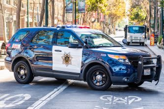Antioch police car stopped on a city street.