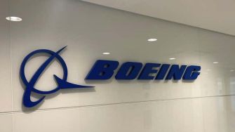 Boeing company logo displayed on a wall.