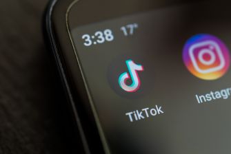 Close-up of a smartphone screen displaying the TikTok and Instagram app icons, with a clock reading 3:38 and a temperature of 17 degrees.