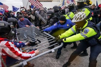 Clash between rioters and law enforcement during the Capitol insurrection on January 6, 2021.