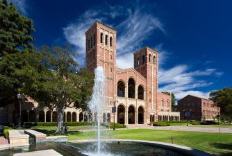 UCLA campus featuring a prominent building and a fountain.