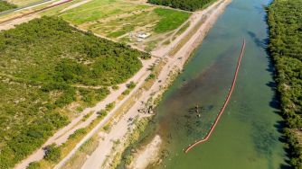 Aerial view of a floating barrier installed in the Rio Grande River near Eagle Pass, Texas, intended to deter migrants from crossing into the US.