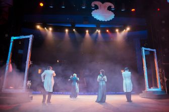 A performance from "The Unofficial Bridgerton Musical" featuring four singers on stage in a theatrical setting.