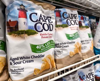 Cape Cod Kettle Cooked Potato Chips on store shelf, featuring labeling that claims "No Artificial Colors, Flavors or Preservatives."