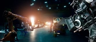 A film set with robotic filming equipment and lighting in the background.