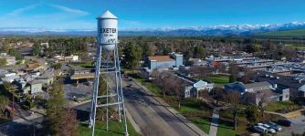 Aerial view of Exeter, California, featuring the Exeter water tower and surrounding landscape.