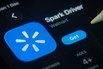 Close-up of a smartphone screen displaying the Walmart Spark Driver app icon and a Get button.
