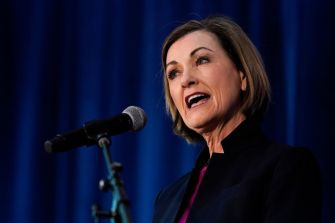 Iowa Governor Kim Reynolds speaking at an event.
