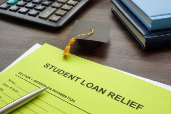 Document titled "Student Loan Relief" with a graduation cap, calculator, and books in the background.