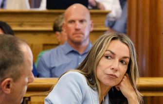 Karen Read sitting in a courtroom during her trial related to the death of her boyfriend, Boston police officer John O’Keefe.