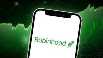 Logo of Robinhood trading app displayed on a smartphone with a green financial graph background.