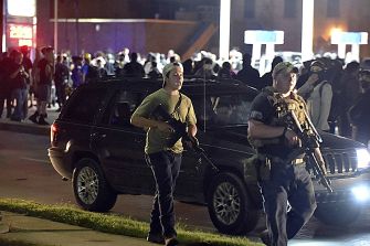 Individuals carrying firearms during a protest in Kenosha, Wisconsin.