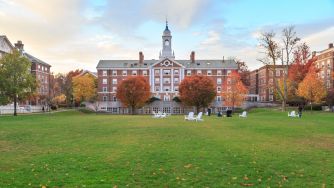 Harvard University campus featuring historic buildings and autumn foliage.
