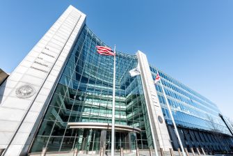 The Securities and Exchange Commission (SEC) building with flags in front, representing the agency's involvement in cryptocurrency regulation.