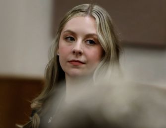 A woman with long blonde hair seated in a courtroom, appearing to testify in a Virginia negligence trial.